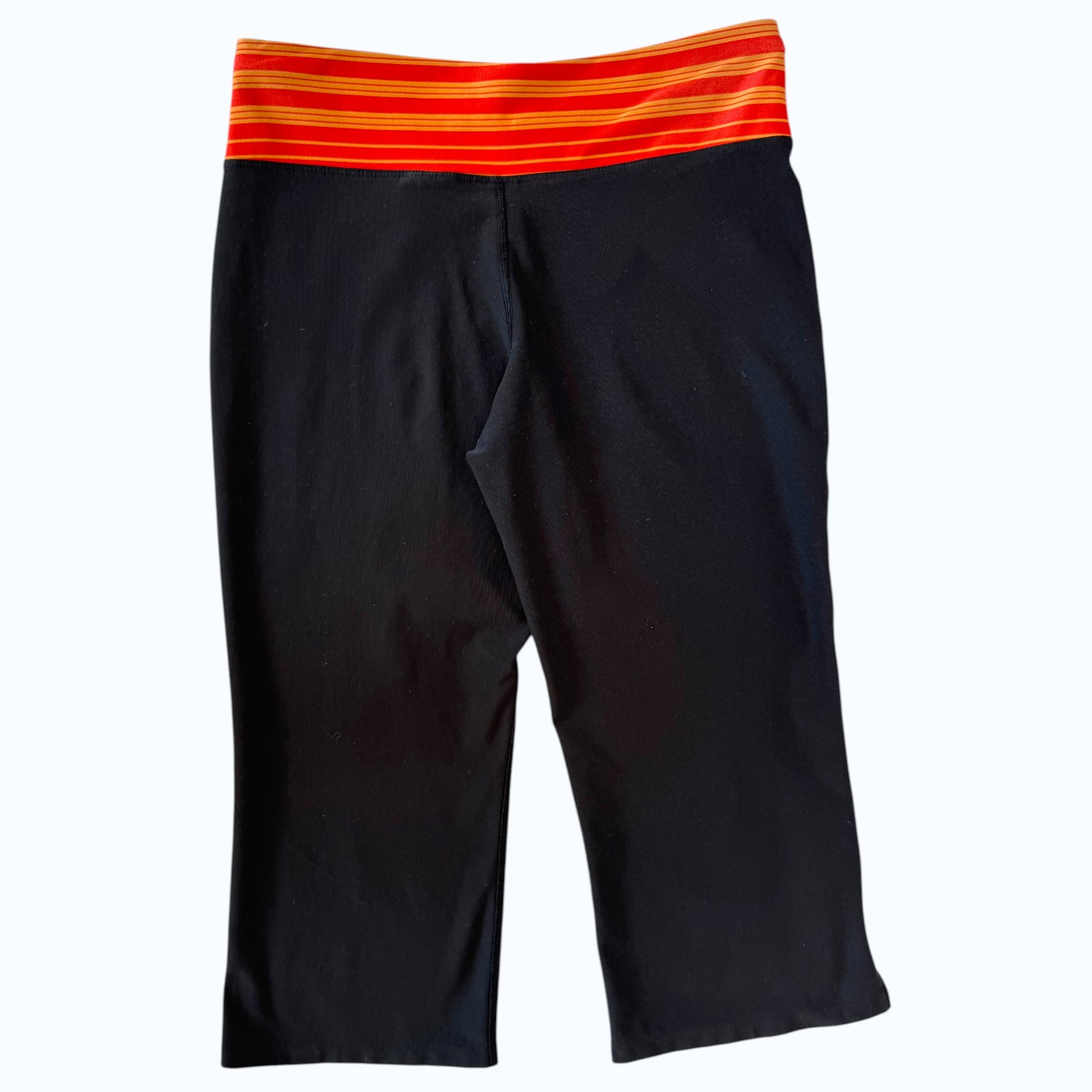 nike_orange_striped_waistband_capri_lay_back